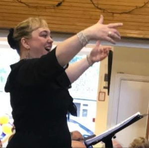 Debs Allen conducting choir